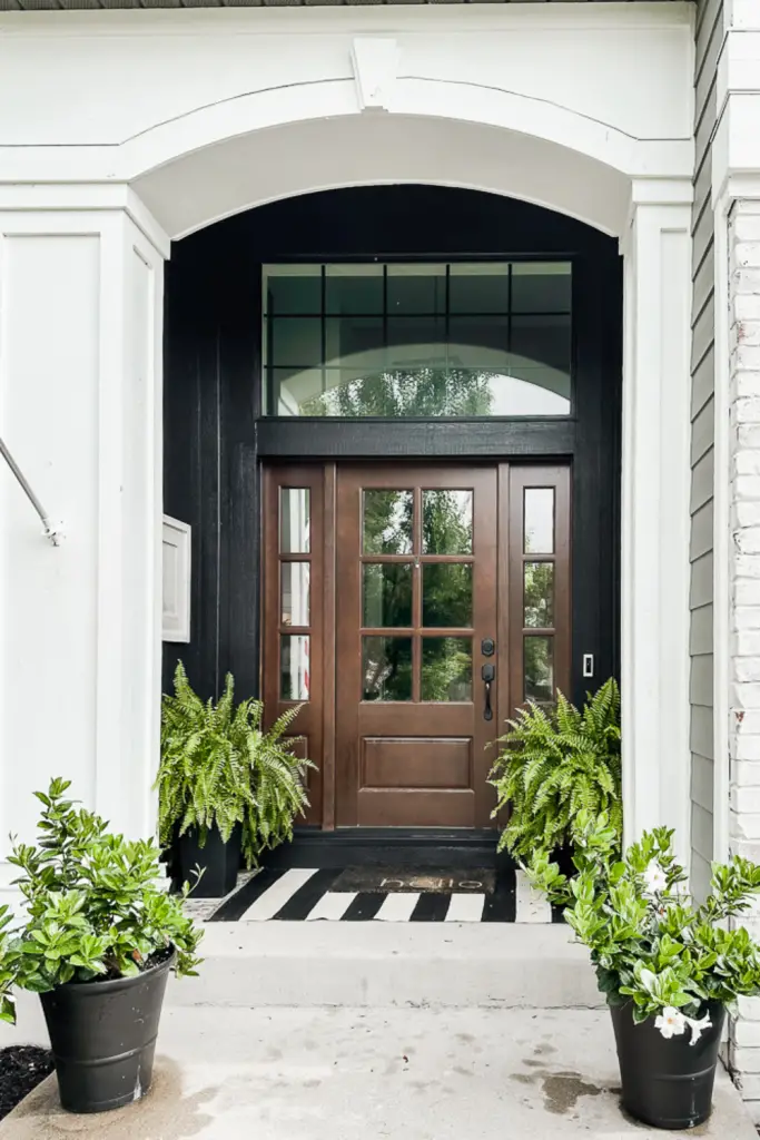 Front porch painted black for curb appeal ideas.
