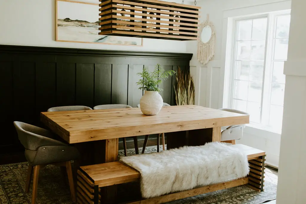 Dining table in a dining room with a bench.