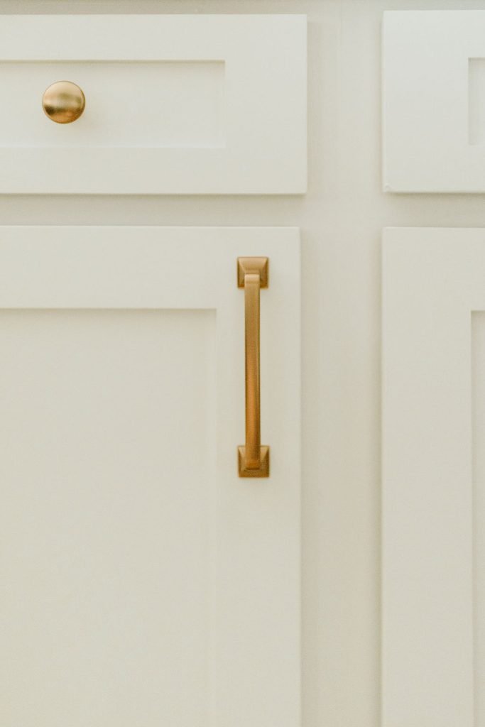 Shaker cabinets and brass hardware for modern kitchen makeover