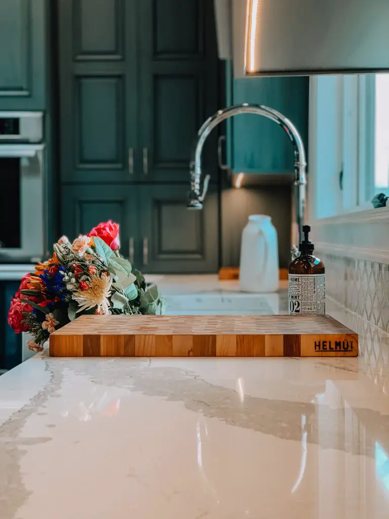 Quartz countertops with a wooden cutting board for Top Kitchen Design Trends.