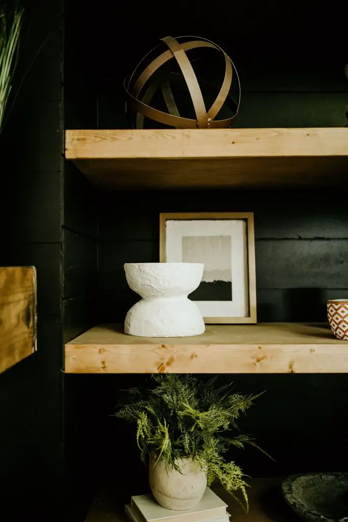 Floating shelves with decor and add greenery to your home.
