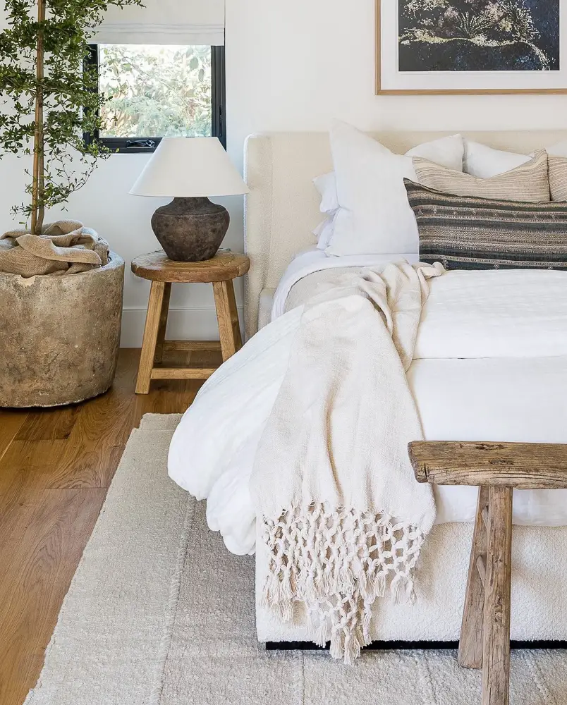 Bedroom with a bench at end of bed for home doesn't feel cohesive post.