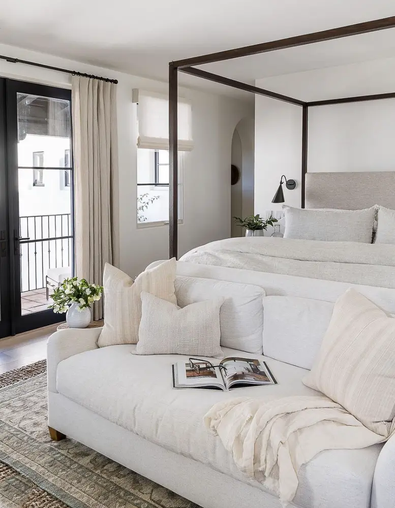 Bedroom with a four poster bed.