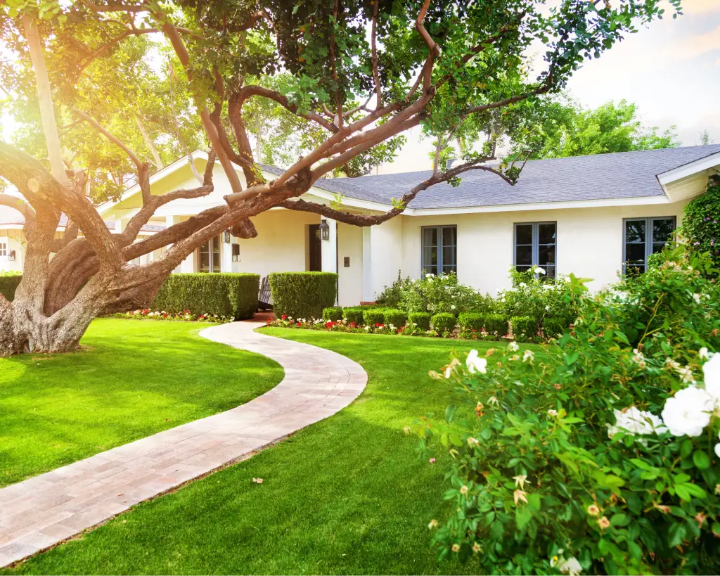 White home with winding sidewalk.