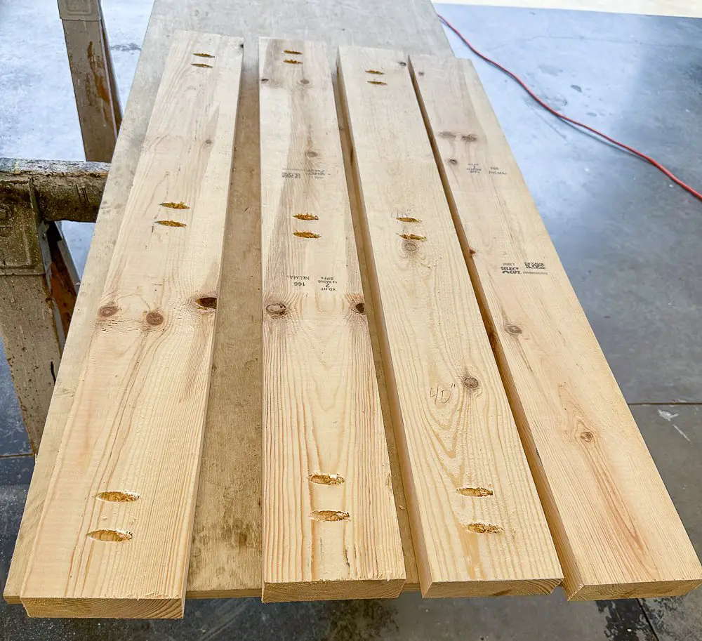 4 2x6 pieces of wood with pocket holes running down the length of them.