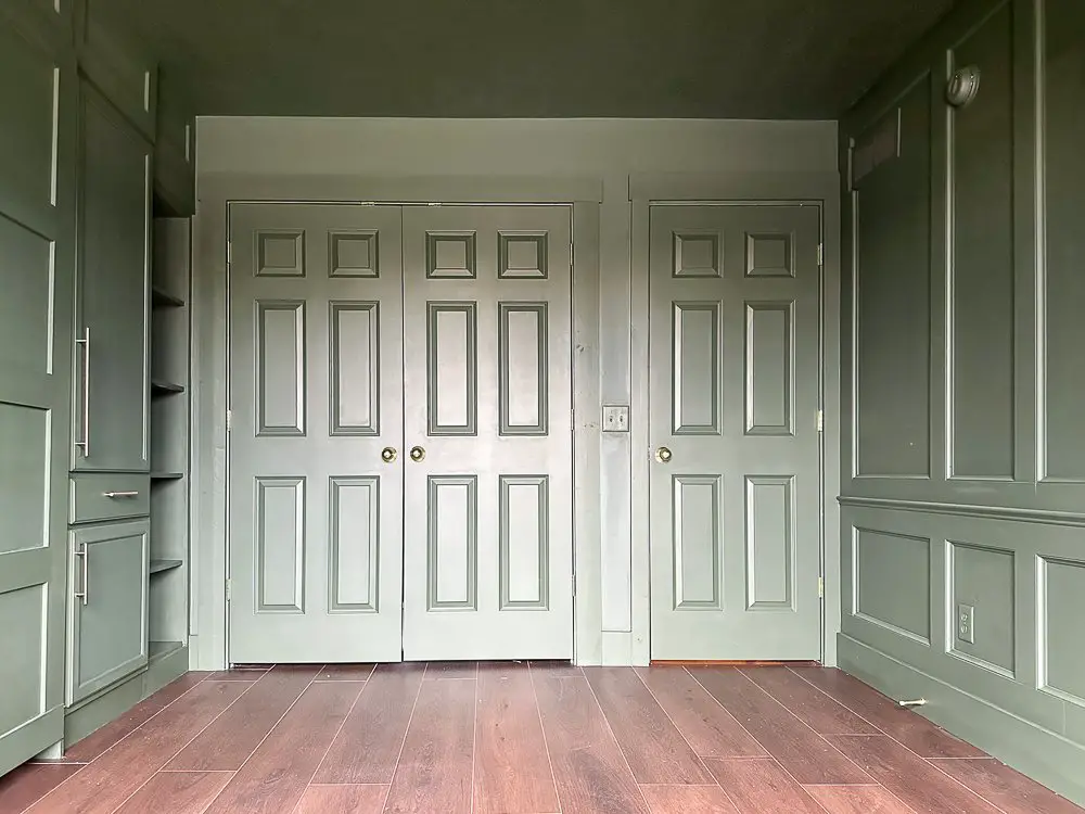 Dark moody doors with dark wood flooring for Home Office Guest Room Reveal.