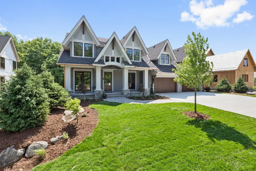 Big modern home with beautiful landscaping.