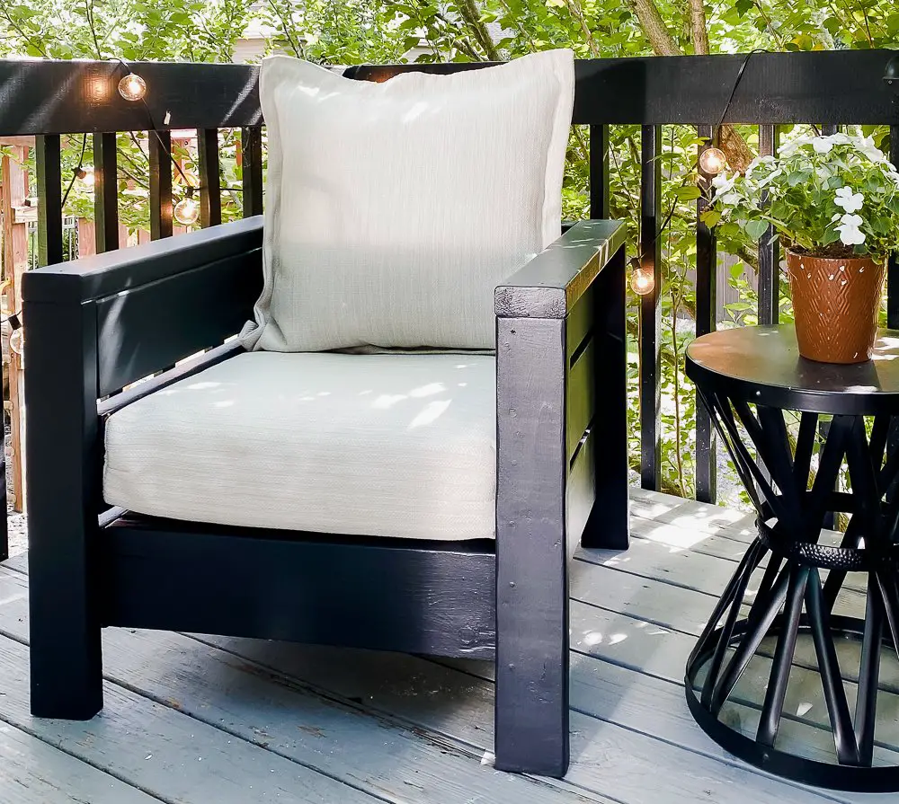 Outdoor black chair on a deck.