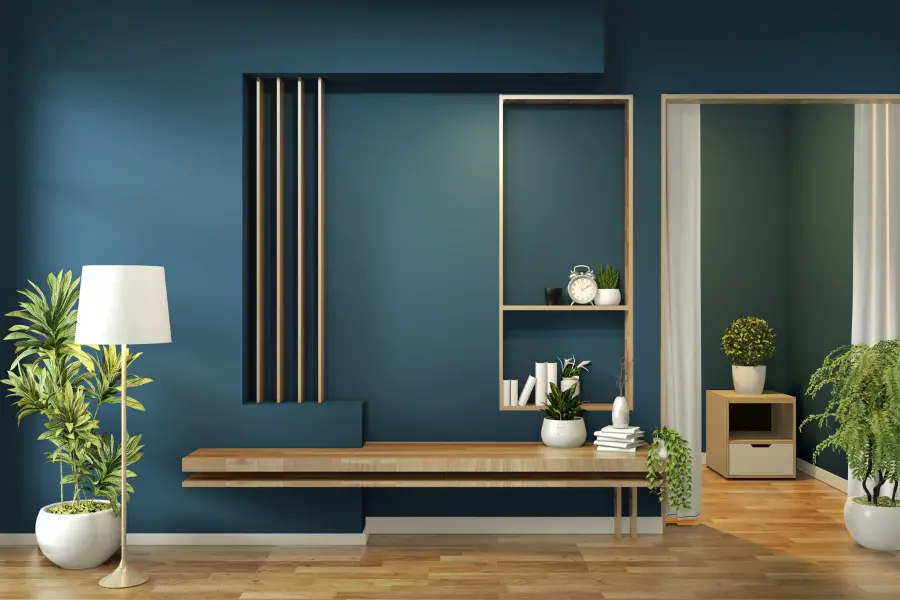 All blue room with a bench.