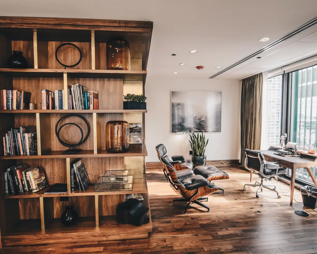 Home office space with bookshelves and a desk.