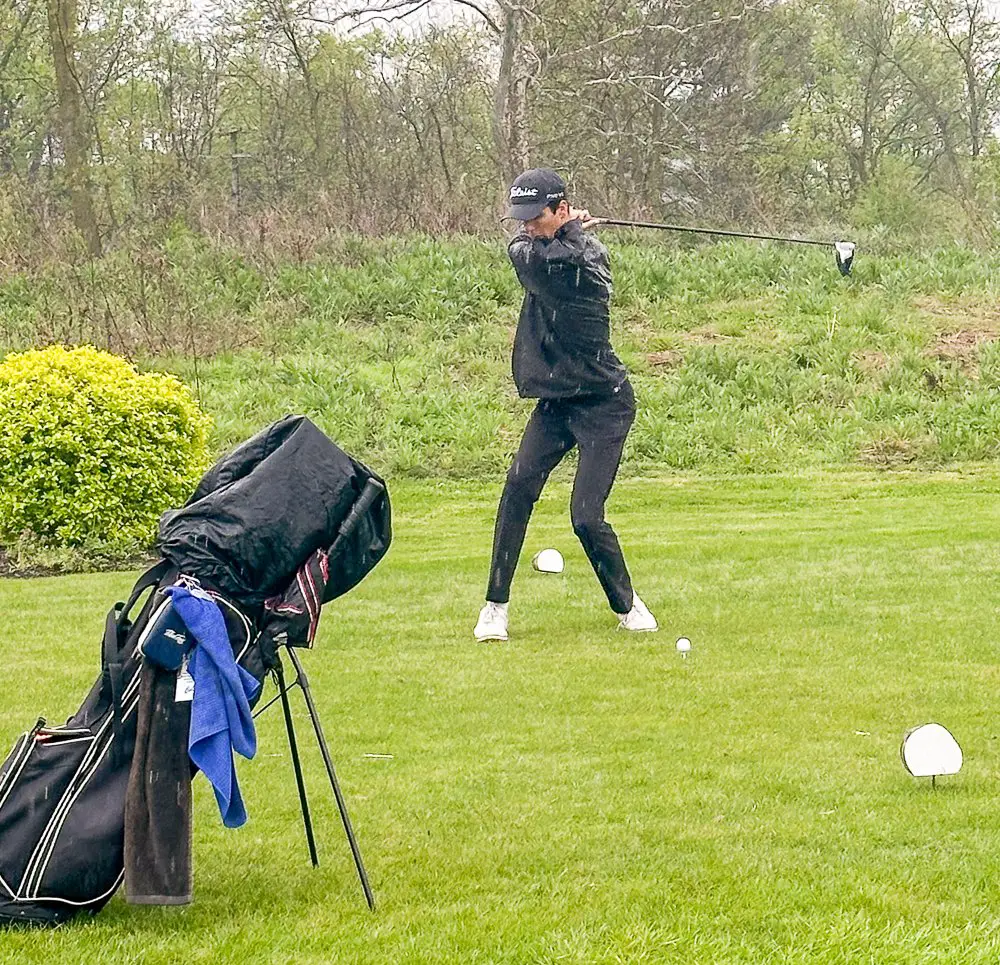 Man playing golf.