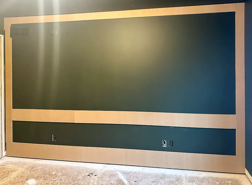 Accent trim on a green wall.