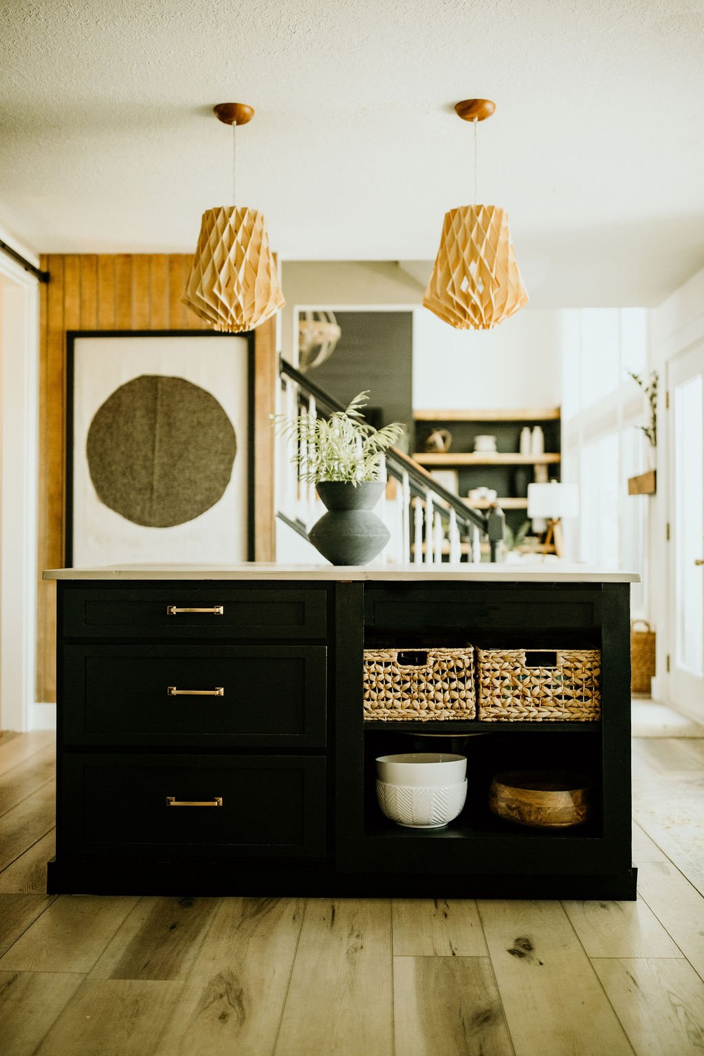 D2B_2022-61 Kitchen island with a large artwork behind it for Top Kitchen Design Trends.