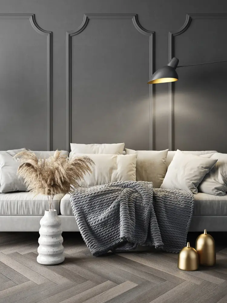 Living room with picture frame moulding and a white sofa.