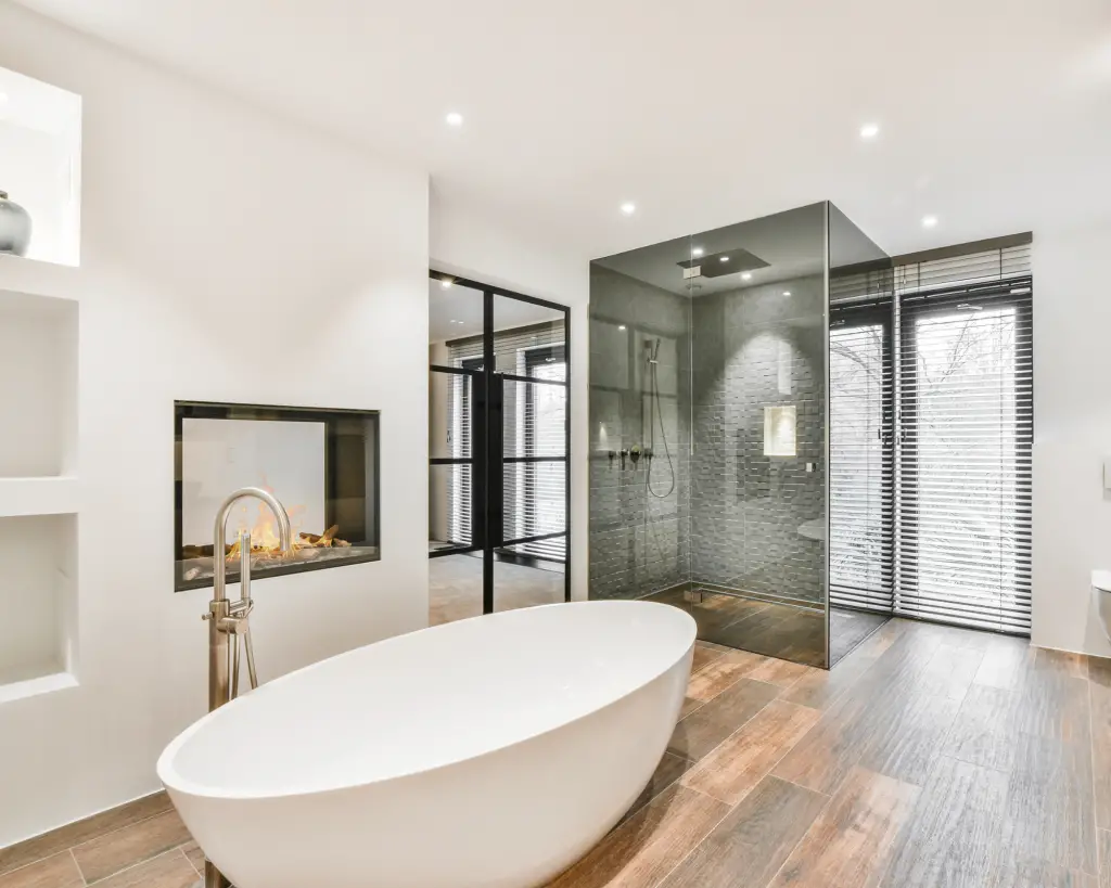 Large white tub in a huge modern bathroom.